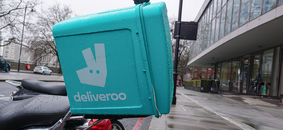 Photo of a Deliveroo box on the back of a motorbike