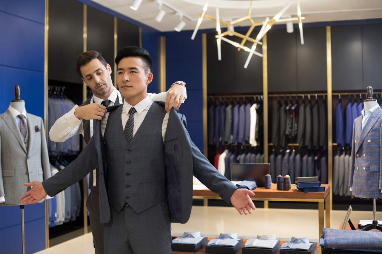 Man in tailors using NatWest Premier service