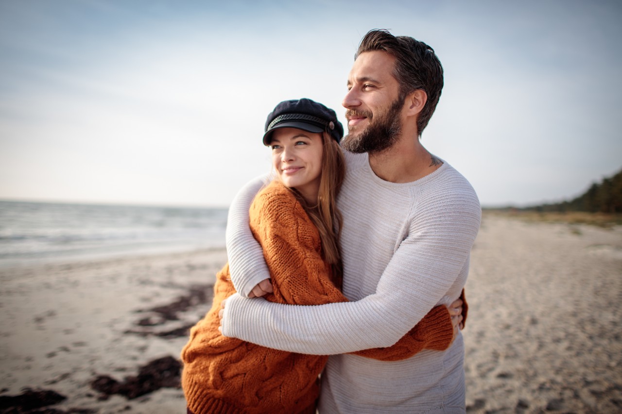 Couple on beach using NatWest Premier service